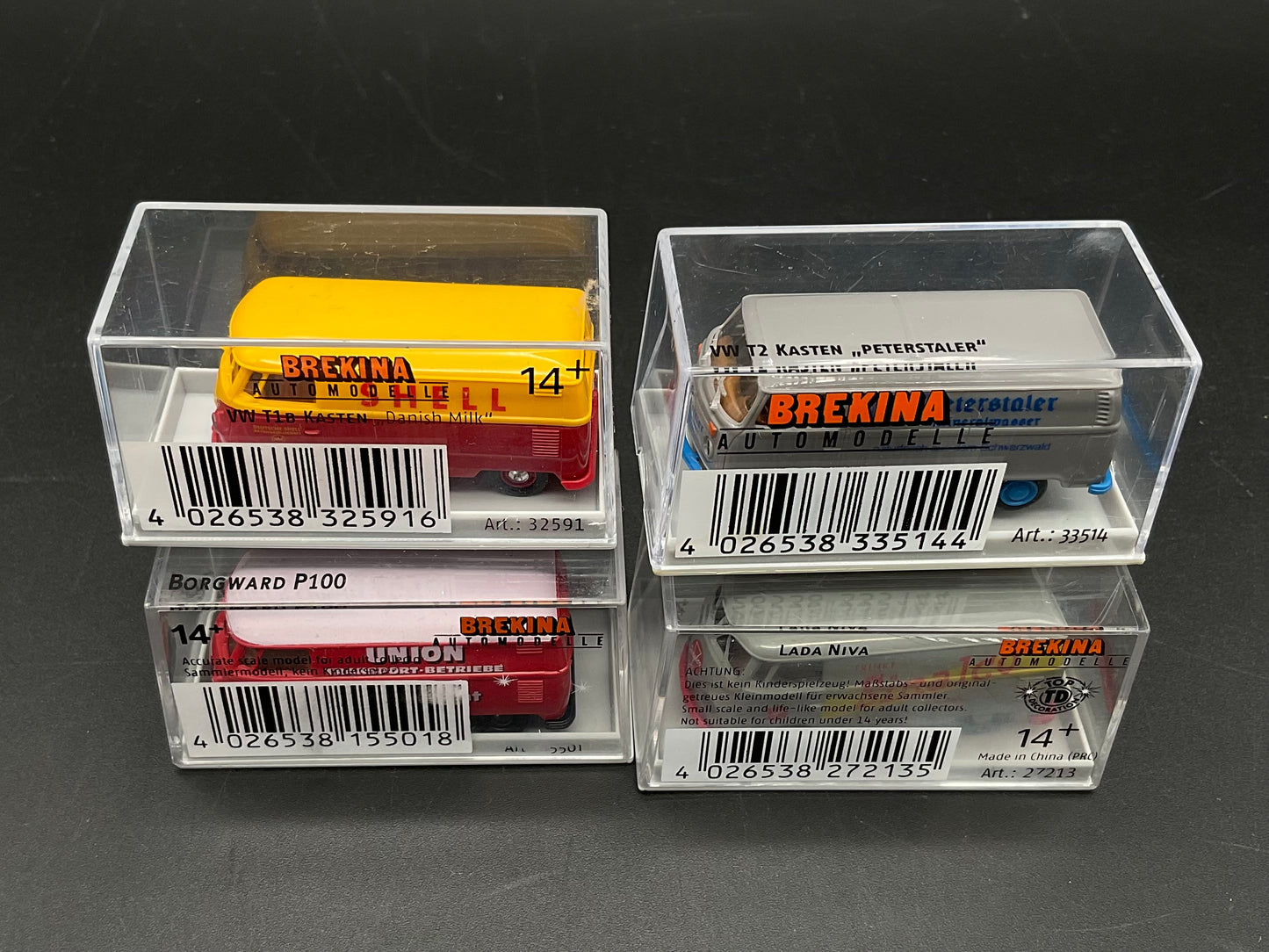 Vier Brekina Modellfahrzeuge