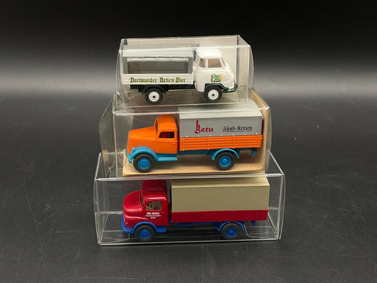 Drei Pritschenwagen von Wiking
