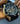 Gold-schwarze Raoul u Braun Herrenuhr