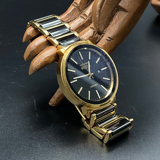 Gold-schwarze Alexander Milton Uhr