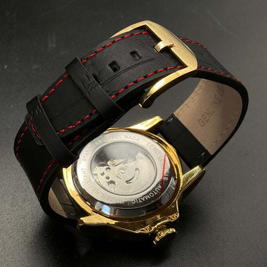 Gold-schwarze Leno Leontis Uhr