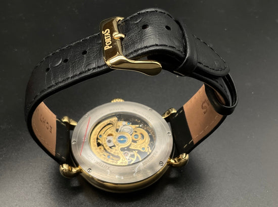 Gold-schwarze Portas Skelettuhr