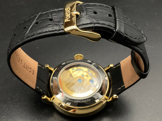 Gold-blaue Portas Uhr