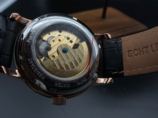 Roségold-schwarze Portas Uhr