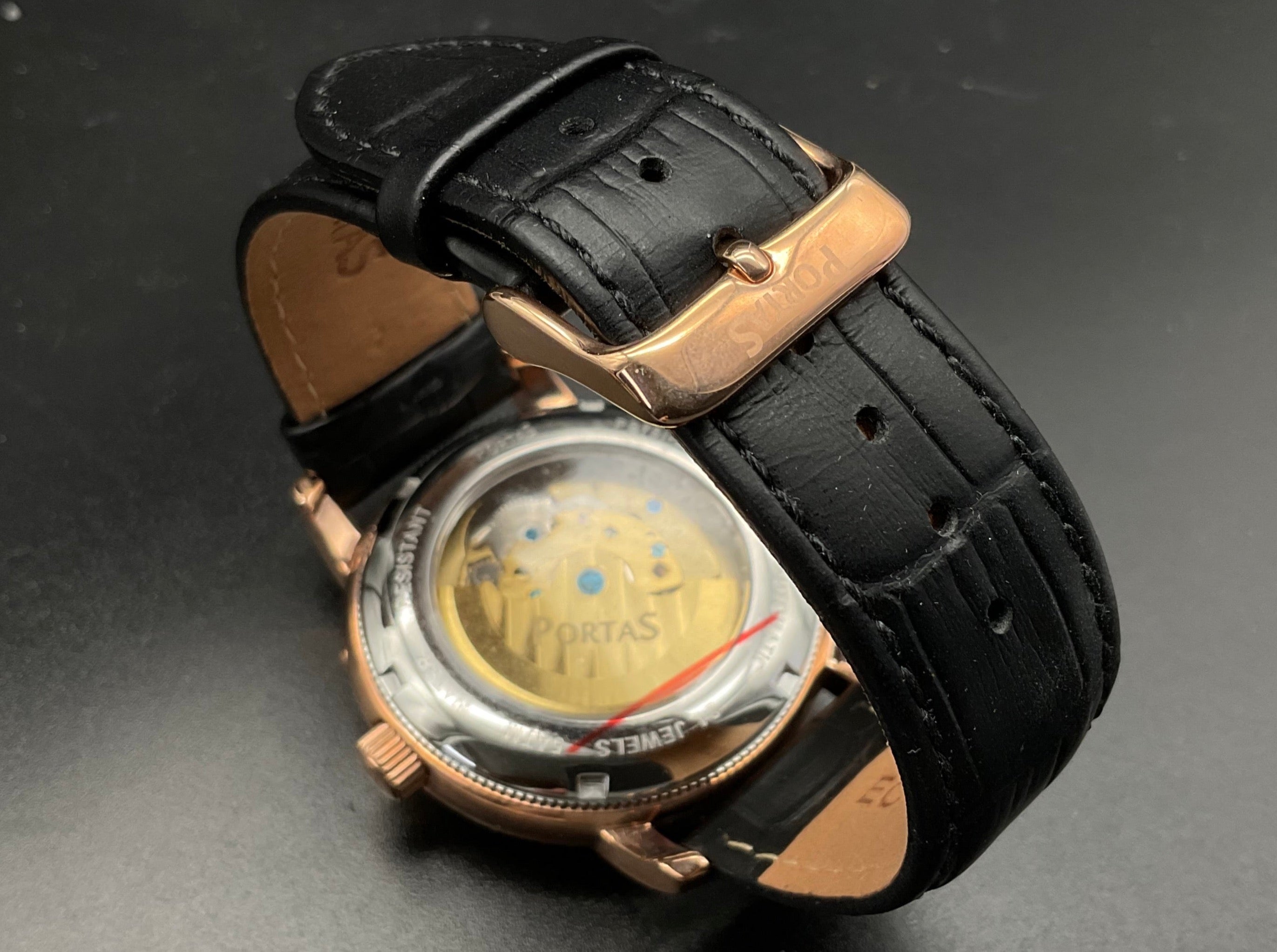 Roségold-schwarze Portas Uhr