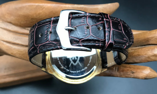 Gold-grüne Königswerk Uhr